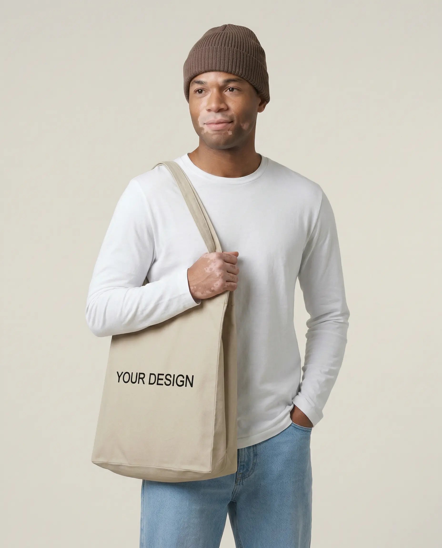 Sustainable T-shirt made from fair trade organic cotton, printed with a logo as corporate fashion. A model presents the shirt for illustration purposes with the placeholder 'Your Logo' on the left chest.
