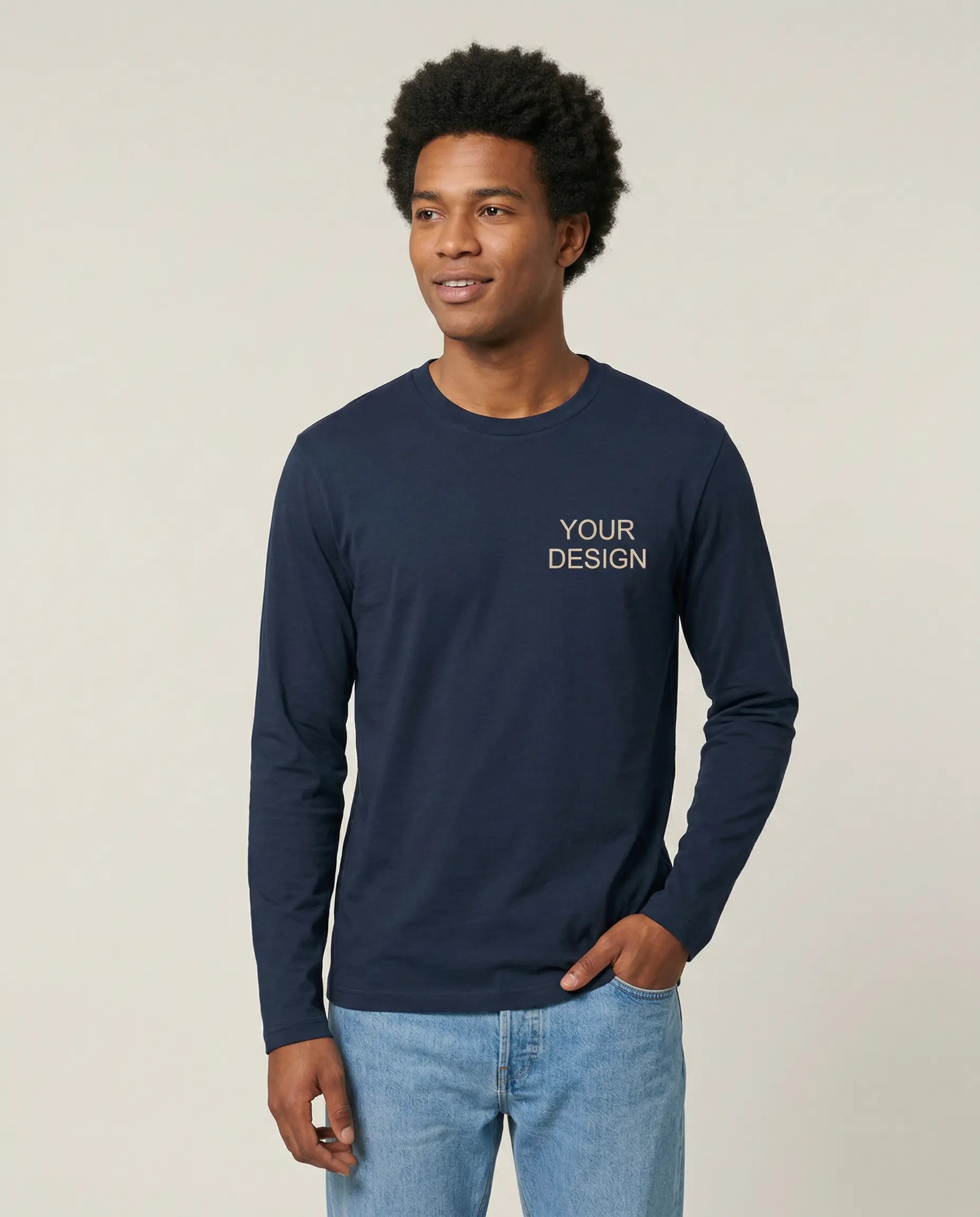 Comfortable Fair Trade sweatshirt made from organic cotton, embroidered with a logo for B2B use. The model showcases the sustainable teamwear with the high-quality sample embroidery 'Your Logo' on the left chest.