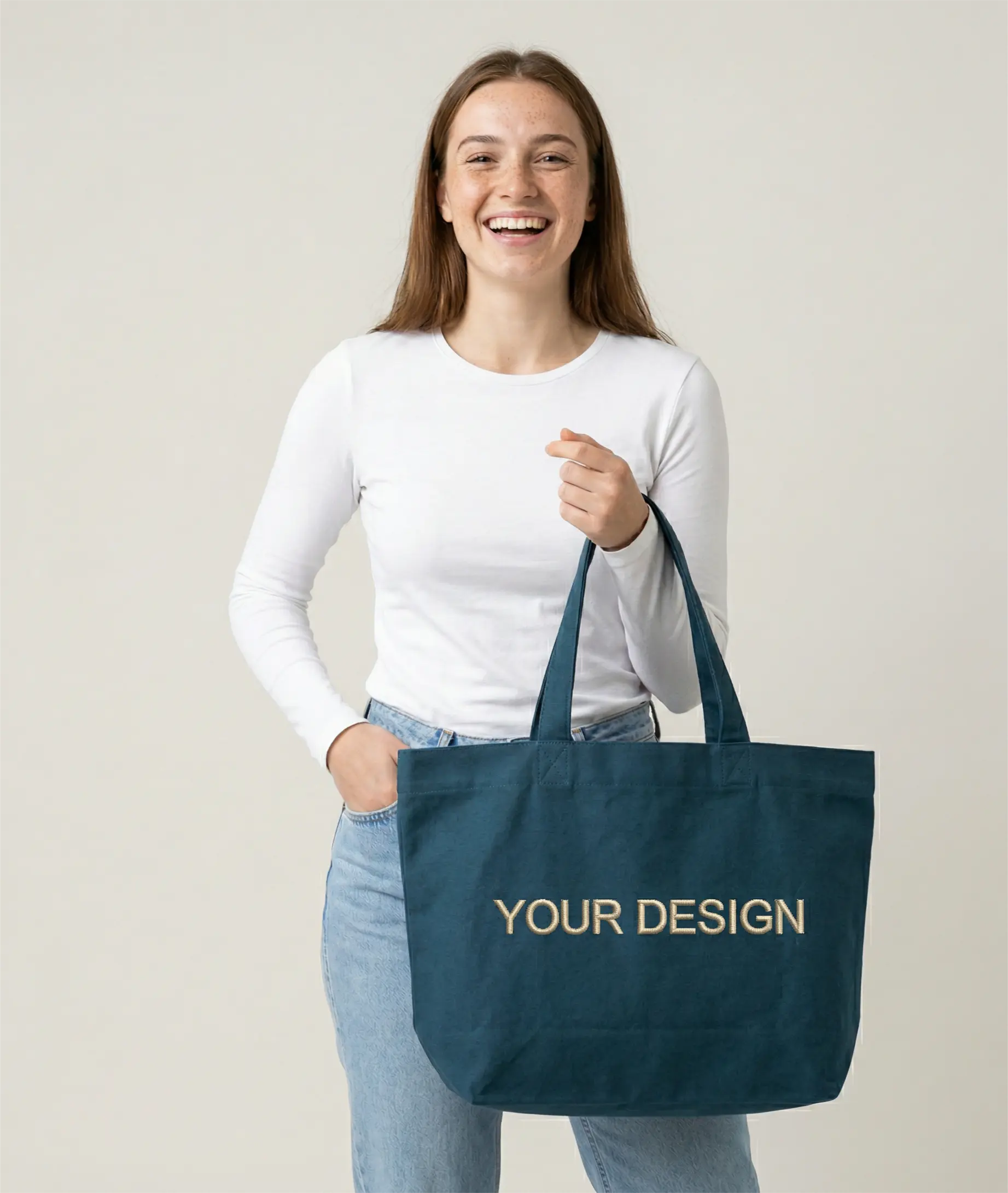 Sustainable T-shirt made from Fair Trade organic cotton, printed with a logo as corporate fashion. A model is showcasing the shirt for illustration purposes with the placeholder 'Your Logo' on the left chest.