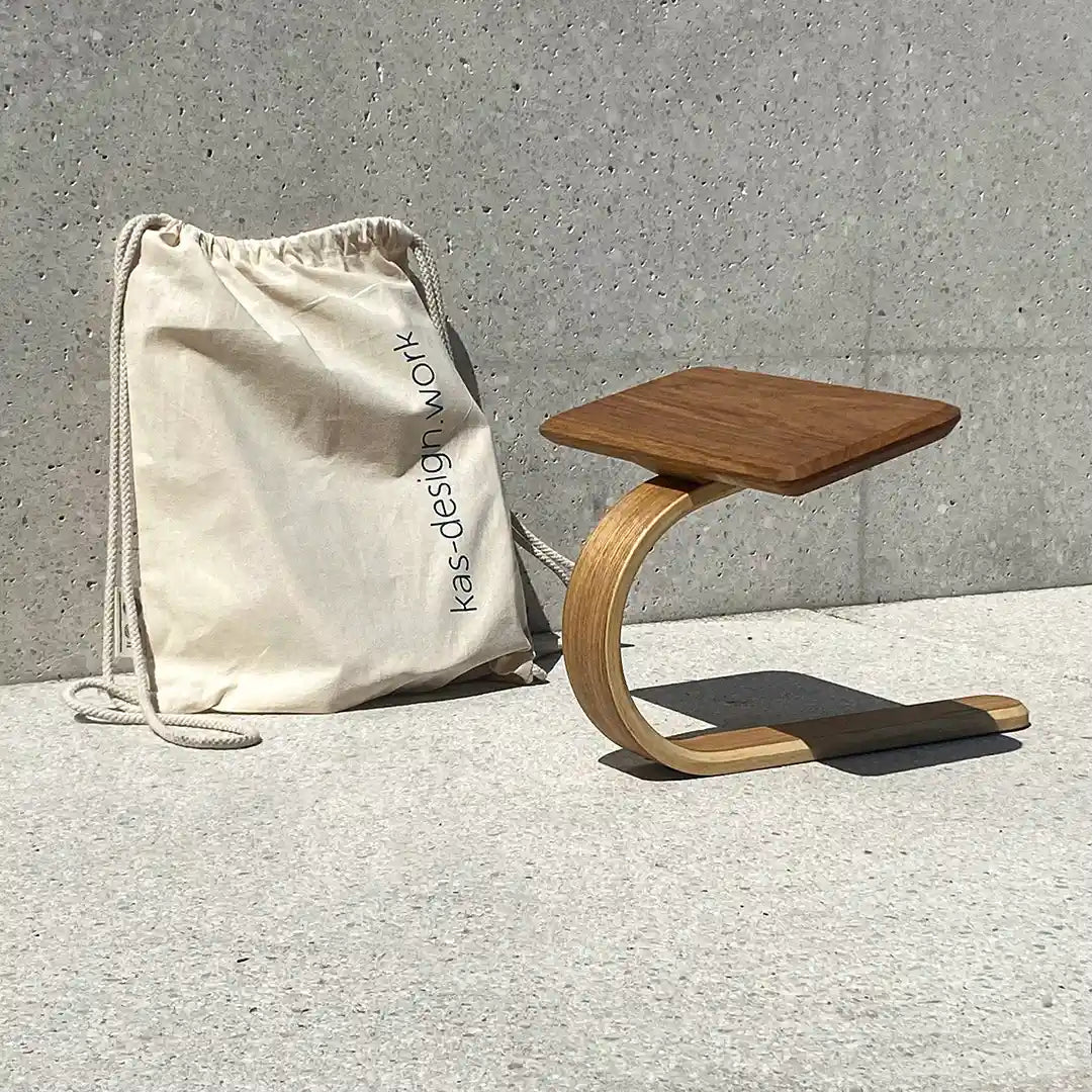 Durable drawstring bags made of heavy organic cotton for the Lukas Brinkschulte carpentry with abrasion-resistant logo print.